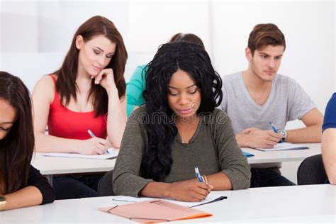 Multiethnic College Students Sitting In A Row Stock Photo Image Of