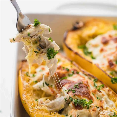 Simple and healthy spaghetti squash boats stuffed with creamy chicken, bacon, spinach, and cheese. Chicken Alfredo Spaghetti Squash Low-Carb, Keto - Cooking LSL