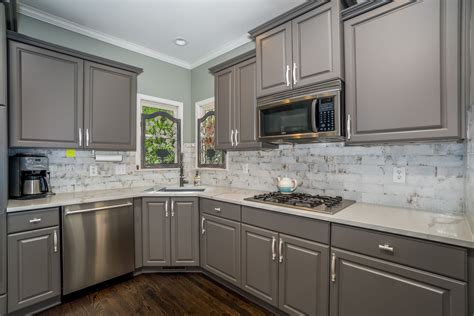 Outdated Wood Cabinets Refinished In A Beautiful Gray New Quartz