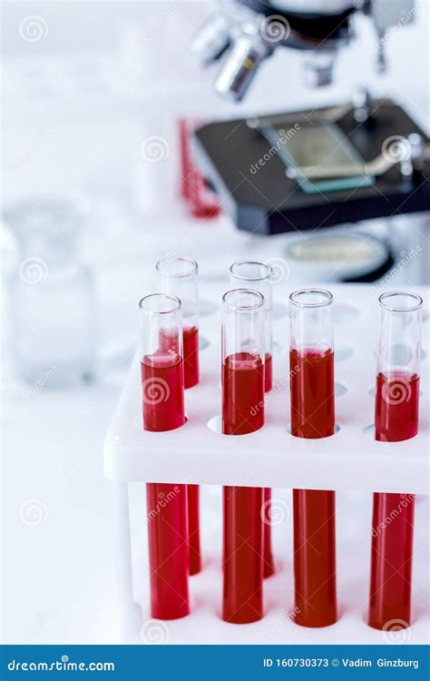 Blood In Glass Tubes On Background Of Microscope Stock Image Image Of