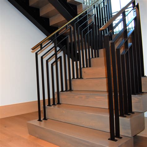 This modern staircase features carpeted stairs which are a few nice detail that gives it a warm and casual look. Modern Industrial Stairs - Compass Iron Works