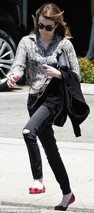 Emma Roberts Flashes Just A Hint Of Her Toned Tummy As She Sets Off At A Run In Her Ballet Pumps