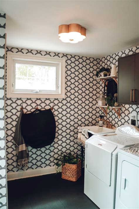 It only really works if you actually make the most of this space. Laundry Room Makeover with Tempaper Removable Wallpaper and Painted Laminate - Nesting With Grace