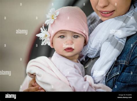 Mother Holding Her Baby Daughter On The Beach Stock Photo Alamy