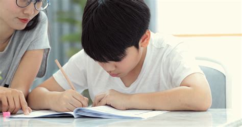 asian mom is helping son to do homework of stock footage sbv 321095465 storyblocks