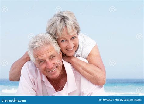 Senior Couple Relaxing On Beach Holiday Stock Photo Image Of