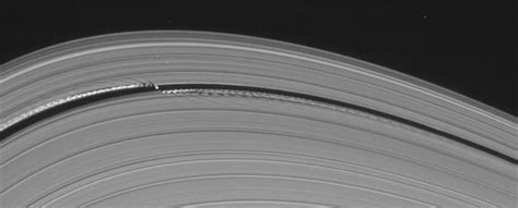 Saturns Little Wavemaking Moon Universe Today