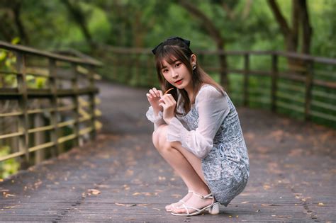 asian model women long hair dark hair squatting barefoot sandal looking at viewer bridge