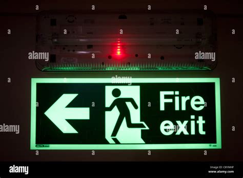 Emergency Exit Light With An Luminous Fire Exit Sign Stock Photo