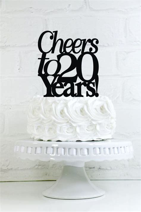 Anniversary cakes from caker street is beautifully crafted with handmade decorations and in some cases we use toy toppers as per customer's demand. Cheers to 20 Years 20th Anniversary or Birthday Cake ...