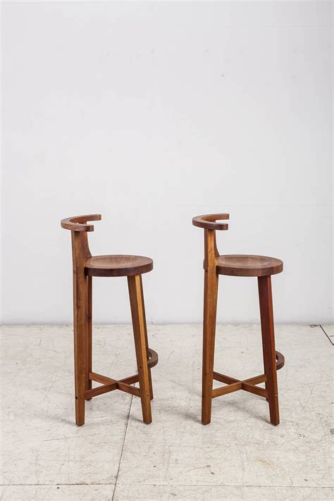 Shopping for a wooden chair? Pair Studio crafted wooden bar stools with rounded back ...