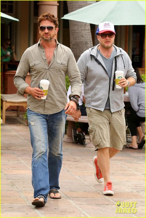 gerard butler scopes out surf gear after kissing session with mystery girl photo 3169582