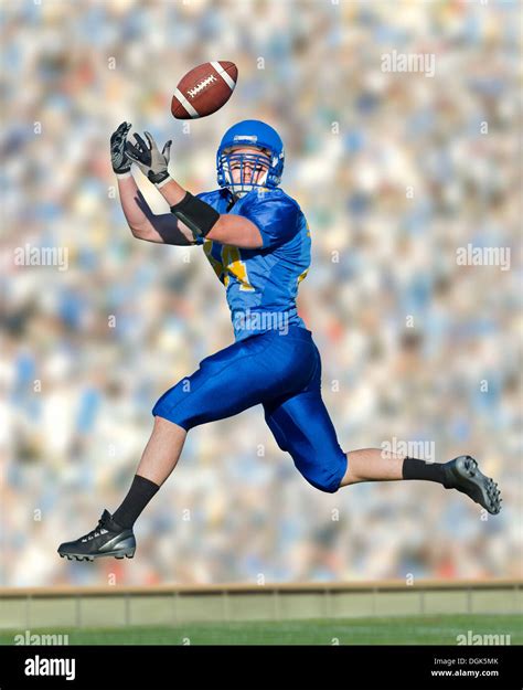 American Footballer Catching Ball Stock Photo Alamy