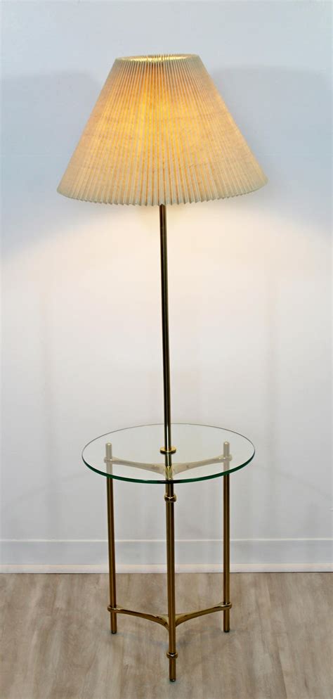 Made from raw unfinished brass and white glass shades this lamp adds easy style to any space. Mid-Century Modern Laurel Brass Glass Tripod Floor Lamp ...
