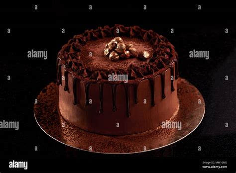 Chocolate Cake With Nuts On A Black Background Stock Photo Alamy