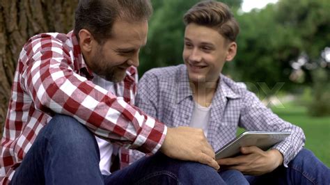 Teen Son Showing Photos Of His Girlfriend To Father Men Talks Trust Relations Stock Image