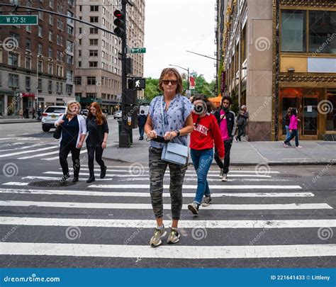 Midtown Manhattan Street Scene With People Crossing The Street At