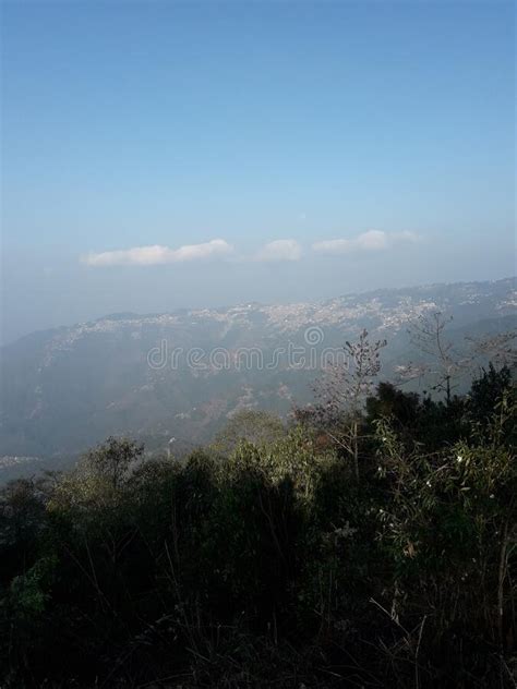 A Foggy Mountain Of A Popular Hill Station In A Sunny Morning With Pine