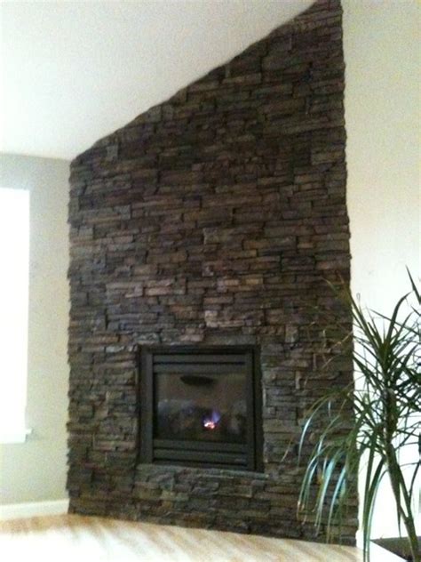 Stacked stone fireplaces are undeniably gorgeous but the natural stone, and the labor to install it, can be expensive. Drystack stone veneer fireplace - Contemporary - Living Room
