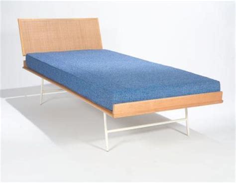 Walnut or white ash, natural cane, veneer, metal. George Nelson Thin Edge twin bed