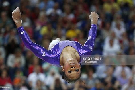 Us Gymnast Gabrielle Douglas Performs On The Beam During The Womens