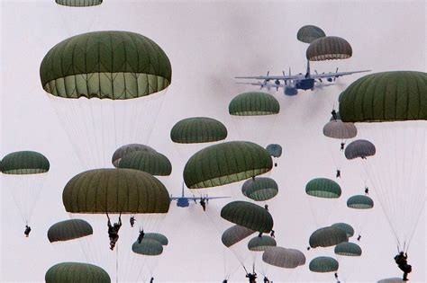 Paratroopers Jump From C 130 Hercules Aircraft During A Large Airborne