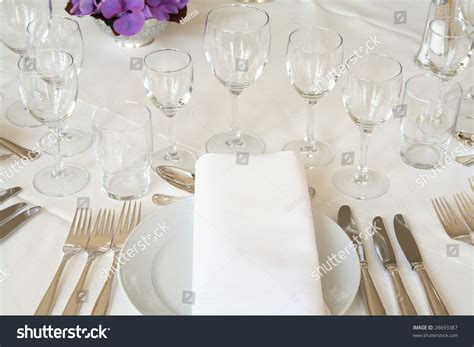 According to the dining etiquette guide found on whatscookingamerica.net, a complete dinner setting of cutlery includes three forks, one dinner knife, two spoons and a butter spreader. Table Setting For Fine Dining Or Party. Cutlery And Plate ...