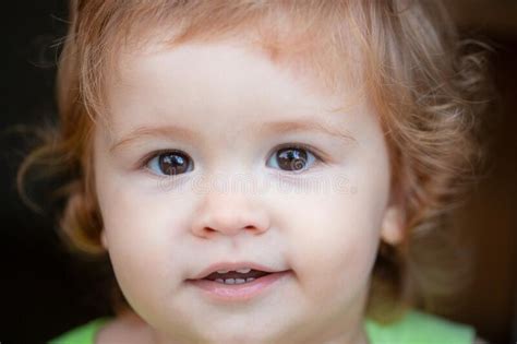 Close Up Macro Portrait Of A Cute Baby Childhood And Parenting Concept