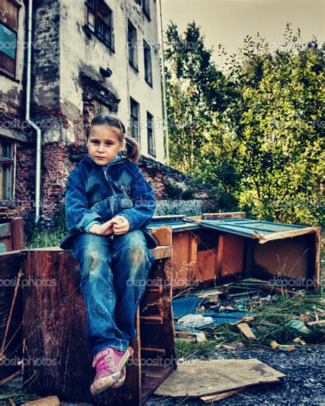 Sad Poor Child In The Ruins Stock Photo By ©khamidulin 35600209