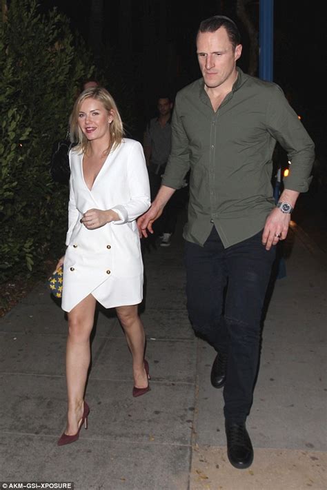 Elisha Cuthbert Bares Cleavage On Chilly Date With Hockey Husband Dion