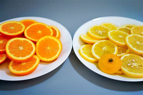 Oranges And Yellow Lemons On A Plate On A Sunny Day Stock Image Image