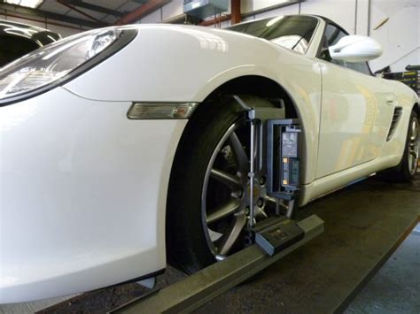 Moving the upper ball joint back, toward the firewall behind it, as it relates to the your car's configuration will determine which direction the upper ball joint moves by adding or removing shims. Porsche Four wheel alignment service, sheffield south yorks
