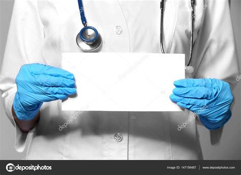 Doctor Holding Blank Paper — Stock Photo © Belchonock 147156487