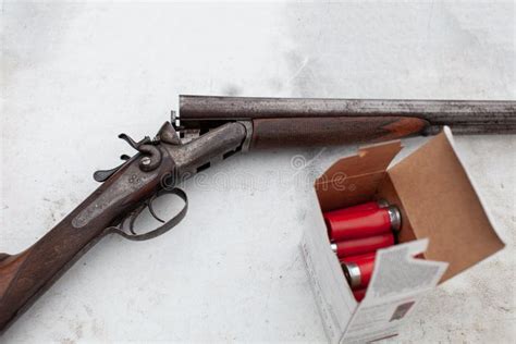 An Old Vintage Break Action Double Barrel Shotgun Featuring Two