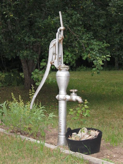 Old fashioned pumb with globe in water droplet. Old Water Pump | Flickr - Photo Sharing!