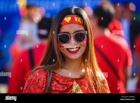 A Fan Of Vietnam Smiles Outside The Stadium Before The Afc Asian Cup