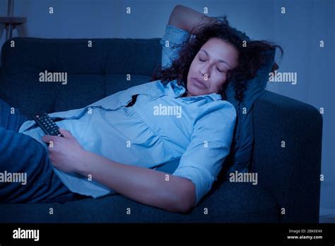 Black Tired Woman Relaxing At Home Watching Tv Stock Photo Alamy