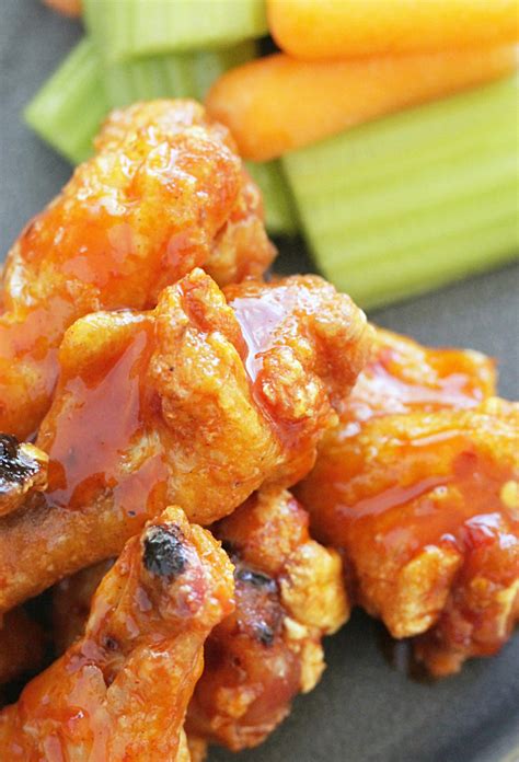 These baked chicken wings are extra crispy thanks to a special cooking method of parboiling to get rid of excess fat, then cooking in a super hot oven. Crispy Baked Chicken Wings - with the best buffalo sauce - Foodtastic Mom
