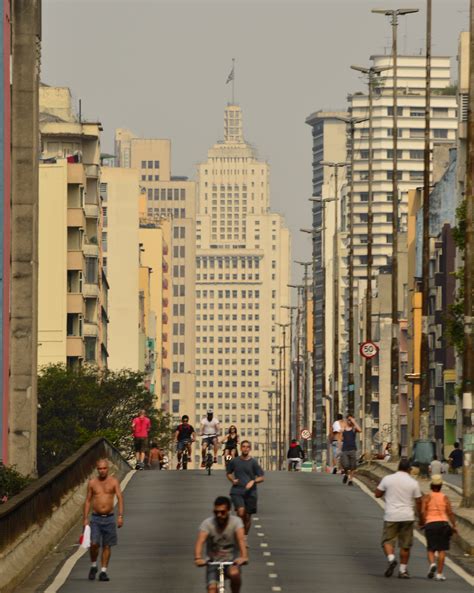 People Walking On Sidewalk Near High Rise Buildings · Free Stock Photo