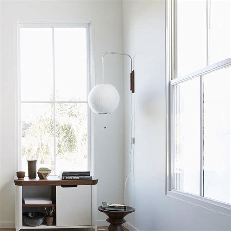 Wall lamp features an adjustable swing arm and black finish. 18 Modern Living Room Wall Lighting Ideas | YLighting Ideas