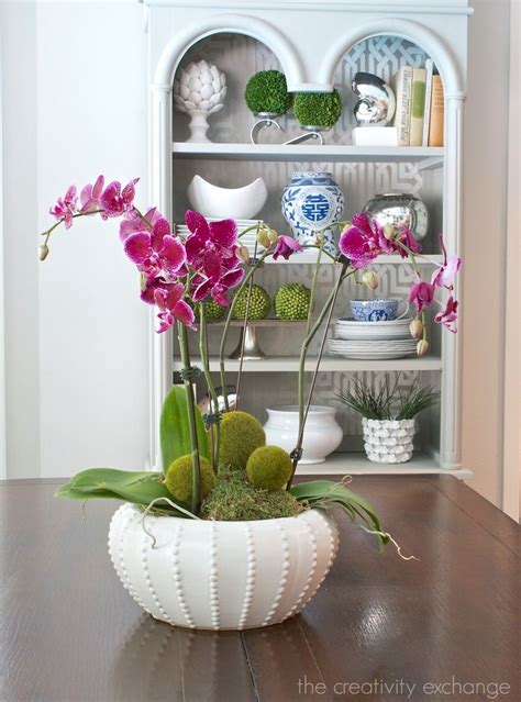 Decorating With Orchids And A Great Trick For Growing Them Orchid Arrangements Growing