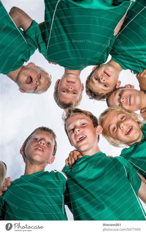 Happy Young Football Players Huddling A Royalty Free Stock Photo From