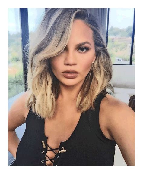 Chrissy Teigen With Her Hair Tousled Skin Dewy And Glowing And