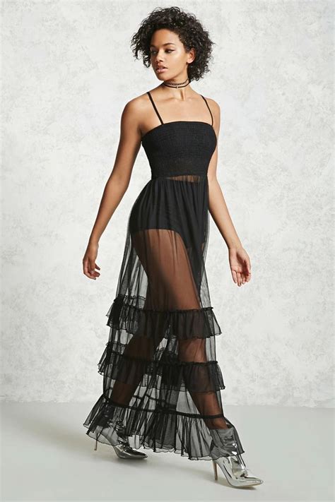 A Sheer Maxi Tulle Dress Featuring Adjustable Cami Straps Smocked