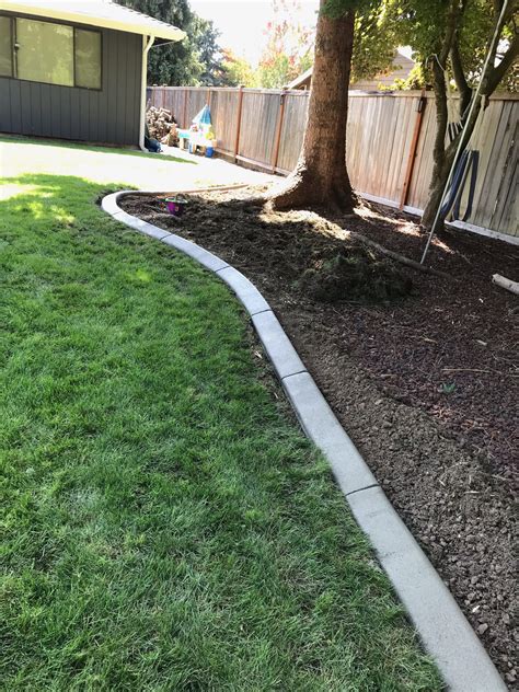 Concrete borders can be used to define your lawn, flower beds and pathways, adding a clean, finished look to your landscaping. Concrete Landscape Borders - Country Cuts Lawn Care Country Cuts Lawn Care