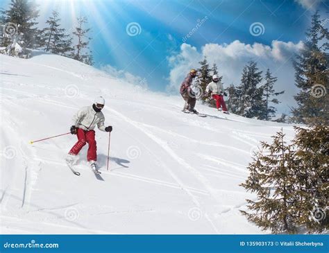 Skier Skiing Downhill During Sunny Day In High Mountains Stock Image