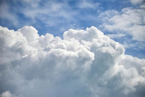 Dramatic Cumulus Clouds With High Level Cirrocumulus Clouds For