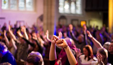 Worshippers Raise Their Hands At A Christian Church Service Stock Photo