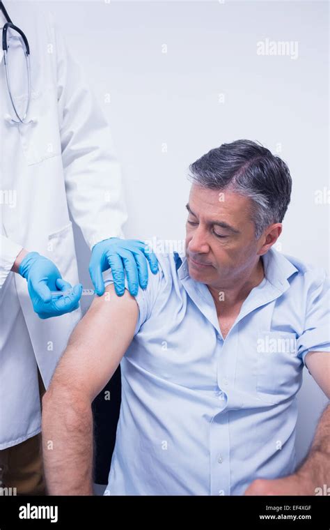 Doctor Giving Injection Male Patient Hi Res Stock Photography And