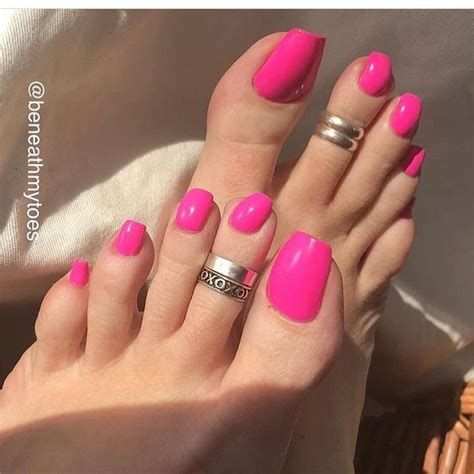 pretty feet with hot pink polish pretty toe nails feet nails pink pedicure